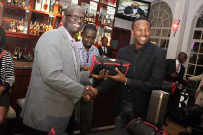 Andrew_Kilonzo_Sales_Director_KBL_present_a_gift_to_Mike_Makori._Makori_was_among_the_winning_Team._Others_winners_were_Emmanuel_Gachiri_Mutegi_and_Wamboi.jpg