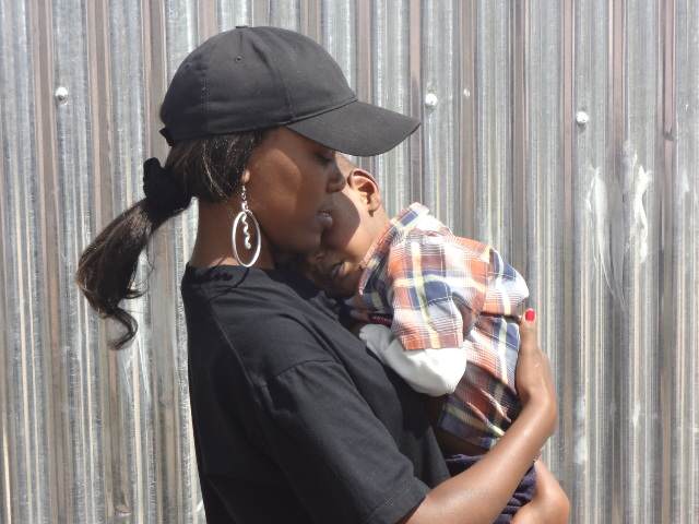 Janet Nariki Kirina with an orphaned child