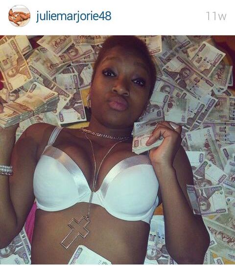 Julie_Marjorie_with_a_stack_of_money.jpg