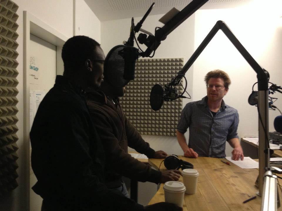 Tosh and Olwenya with the radio speaker Ben Ebling