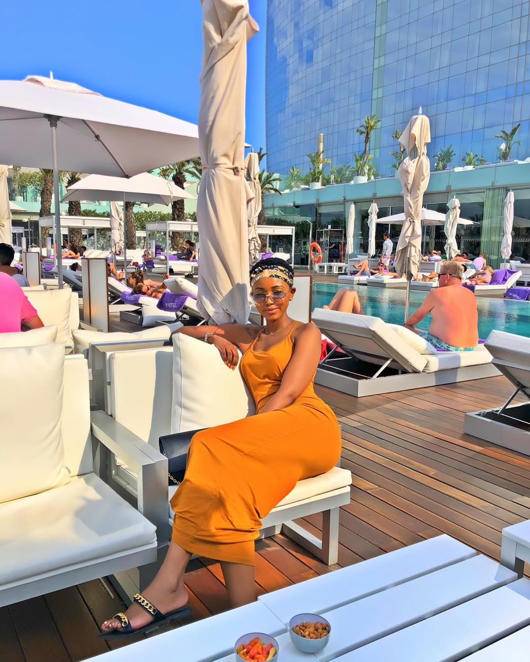 Huddah Monroe having a good time in Barcelona, Spain. Notice the old men in the background.