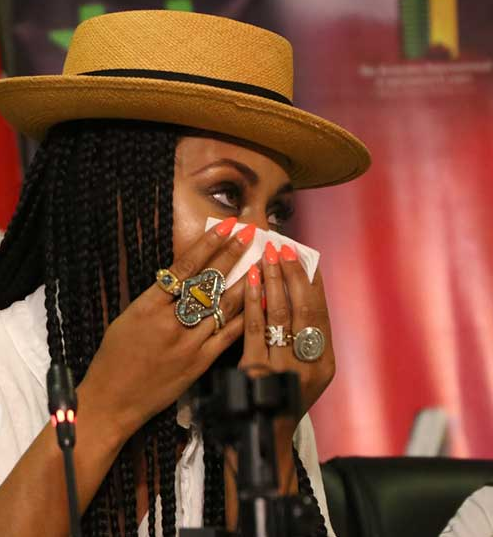 Keri Hilson wipes tears rolling down her face