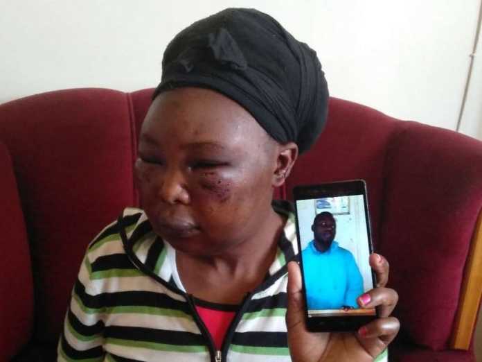 Valerie Masibo shows photo of her husband on her phone