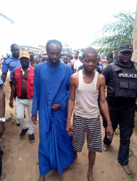 Prophet Olusola Akindele and Prophet Ayodele Bamiduro being escorted by the police