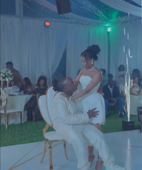 Kathy Kiuna’s son, Jeremy holds white wedding