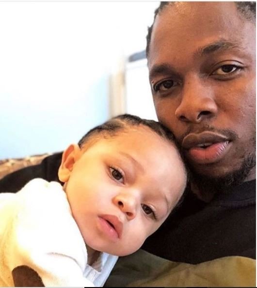 Photo of Runtown and his cute baby boy Zamar