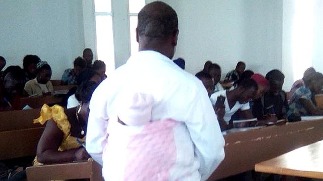 Professor carries baby on the back