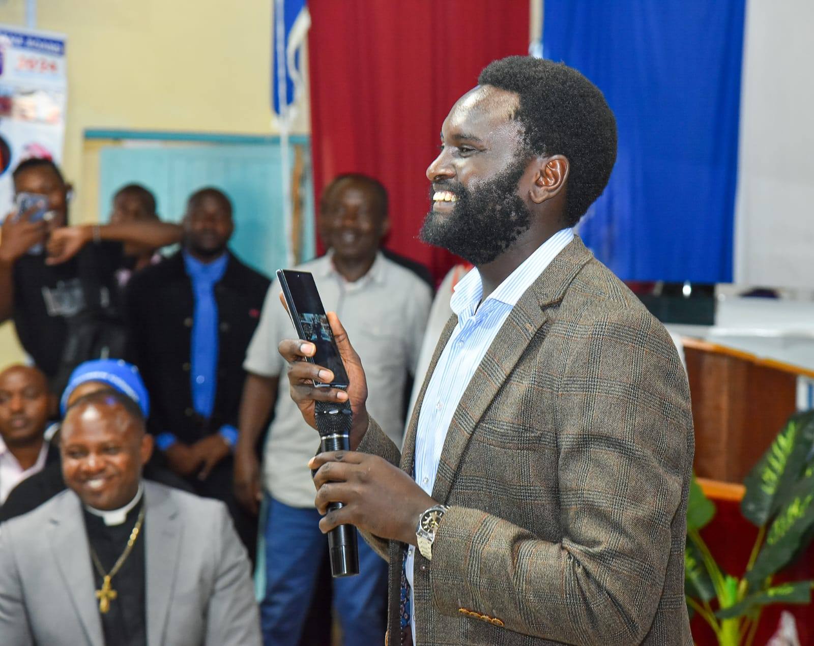 Senator John Methu sets the timer for his shave