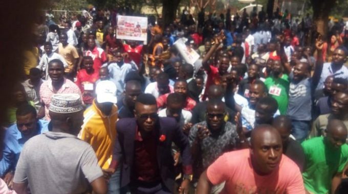 Crowds Chant “People Power Our Power “Outside Rubaga Cathedral