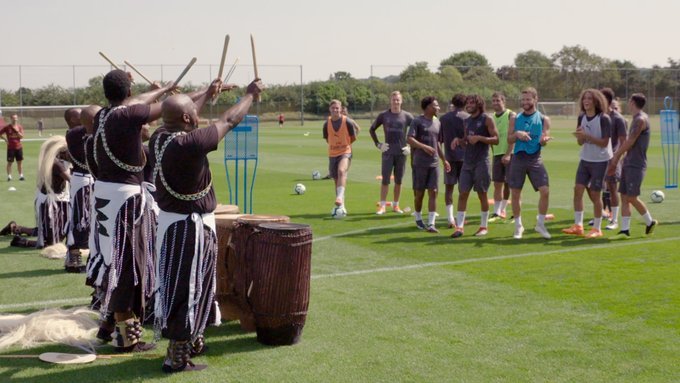 Rwandan Dance troupe surprises Arsenal team with Performance on their home feild