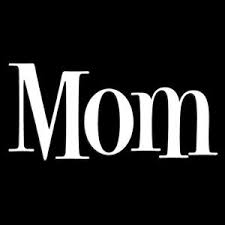 Mom dresses up in lingerie in a family photo shoot
