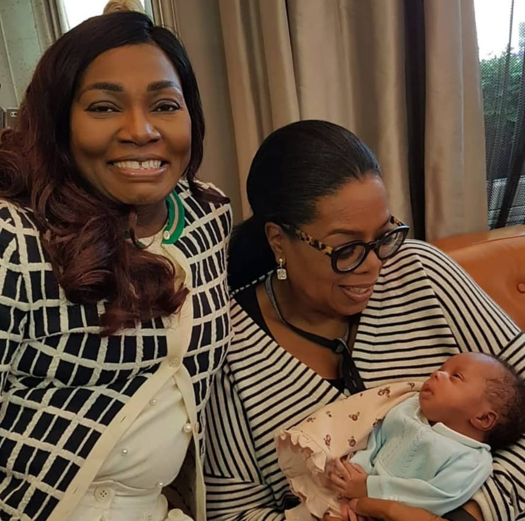 Photos of Oprah Winfrey cuddling Vivian Chilogi’s daughter