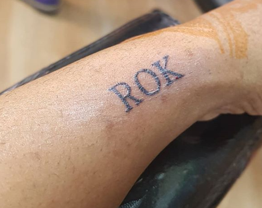 Laura Ikeji inscribes son’s name on her hand