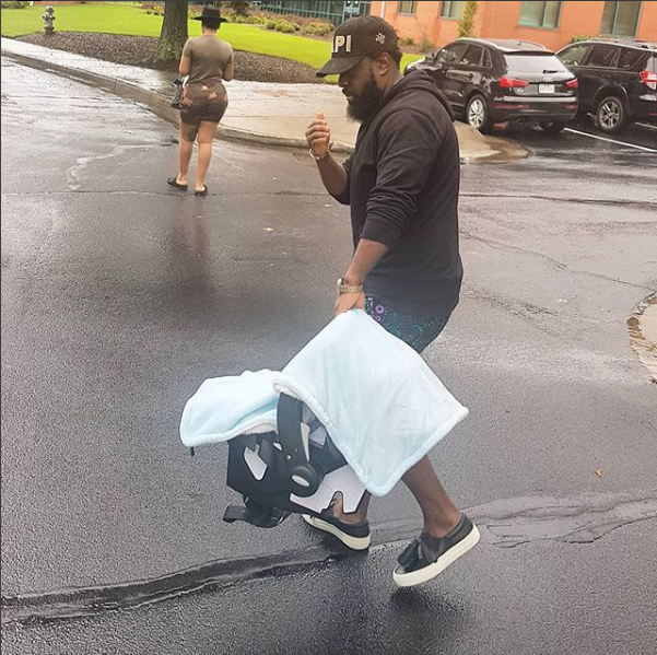 Photo of singer Timaya and his son, Emmanuel in Atlanta