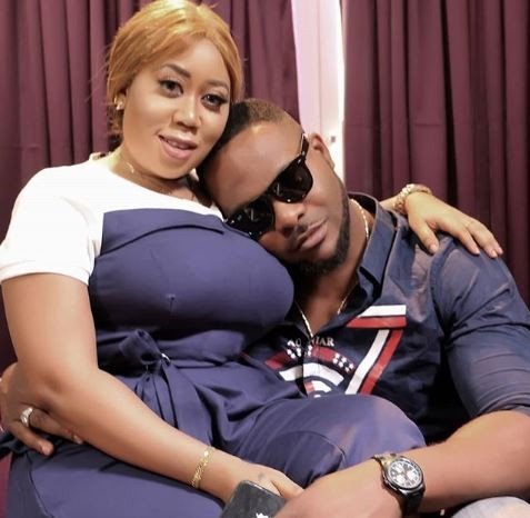 Actor Bolanle Ninalowo and Actress Moyo Lawal being playful on a movie set