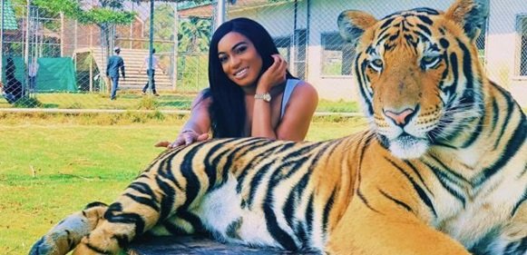 Actress, Chika Ike Relaxing with a Tiger in Thailand (Photo and Video)